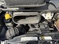 The engine compartment of a 2017 RAM Promaster showing the air intake system and various engine components