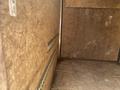 Interior of a 2020 Stealth Enterprises Trailer featuring wooden walls and a smooth floor with track systems along the sides