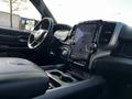 Interior view of a 2019 RAM 1500 showcasing the dashboard and center console with a touchscreen display and leather upholstery