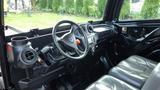 Interior view of a 2018 Kubota RTV X1100c showcasing the steering wheel dashboard controls and seating