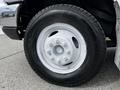 Close-up of a white wheel and tire from a 2016 Ford Econoline featuring a Michelin Agilis tire on a silver rim