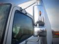 2013 Hino 308 truck with a prominent side mirror and a reflective surface showcasing its shiny finish