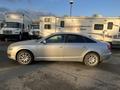 A silver 2006 Audi A6 parked with a sleek design featuring smooth curves and distinctive Audi styling