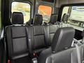 Interior view of a 2019 Mercedes-Benz Sprinter showing black leather seats in the rear passenger area