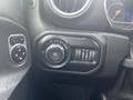 The interior control panel of a 2020 Jeep Wrangler featuring knobs for lights and air conditioning settings