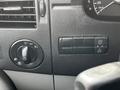 Dashboard controls of a 2017 Mercedes-Benz Sprinter including a headlight knob and buttons for various functions