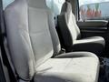 Two gray cloth seats in the cabin of a 2008 Ford F-550 with visible wear and tear on the upholstery