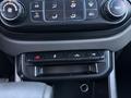 Control panel and buttons in the interior of a 2019 Chevrolet Colorado featuring climate control knobs and additional function switches