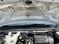 A 2016 GMC Savana engine bay showing the engine and various components under the hood