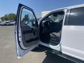A 2017 Ford F-150 with an open door revealing the interior including the steering wheel and dashboard