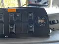 Control panel of a 2006 Emergency One Fire Truck featuring various buttons including work lights and rear scene along with a digital clock displaying 5:12
