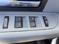 A close-up view of the window control panel in a 2012 Ford F-150 featuring four buttons for power windows and a lock switch