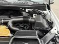 Close-up view of the engine compartment of a 2018 Ford F-150 showing the air intake system and engine components