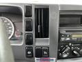 Dashboard of a 2018 Isuzu NPR featuring various control buttons a speedometer and air conditioning vents
