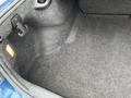 The trunk of a 2022 Dodge Charger featuring carpeted interior with a hook and a light at the side