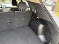 A 2020 Ford Escape features a spacious rear interior with foldable back seats and a large cargo area
