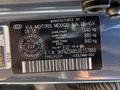 A manufacturer's label from a 2018 Kia Rio5 detailing vehicle specifications including weight and VIN