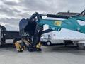 2024 AGT Industrial Green QH13R Mini Excavator with a large digging bucket and tracks ready for operation