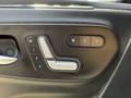 A close-up view of the seat adjustment controls in a 2019 Mercedes-Benz Sprinter featuring buttons for heat and locking