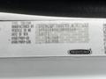 A white 2012 Freightliner M2 106 truck identification plate displaying vehicle information including manufacturer details and specifications