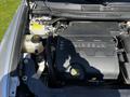 Engine compartment of a 2013 Lincoln MKT showing the engine block and various fluid reservoirs