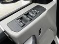 Interior door panel of a 2020 Ford F-350 SD featuring window controls and lock buttons