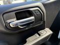 Close-up of a door handle and window controls in the interior of a 2021 Chevrolet Silverado 1500