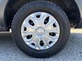 A close-up of a 2016 Ford Transit wheel with a silver rim and Michelin tire showing intricate spoke design
