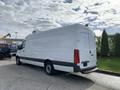 A 2019 Mercedes-Benz Sprinter van with a white exterior and a high roof is parked with its back facing the viewer