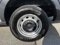 A 2018 Ford Transit wheel with a silver rim and a black tire mounted on it