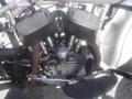 Close-up view of a 1947 Harley-Davidson WL motorcycle engine featuring twin cylinders chrome details and vintage design elements