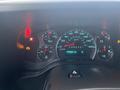 Dashboard of a 2012 Chevrolet Express showing speedometer fuel gauge and warning lights