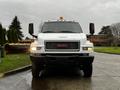 A 2005 GMC C5 Duramax truck facing forward with a white exterior and prominent GMC branding on the grille