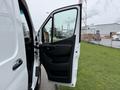 A 2019 Mercedes-Benz Sprinter van with its driver's side door open showcasing the interior door panel and handle
