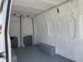 Interior of a 2019 Mercedes-Benz Sprinter van showing a spacious cargo area with grey flooring and blank walls
