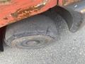 A worn and cracked tire of a 2010 Toyota 7FGGU25 forklift showing significant signs of damage