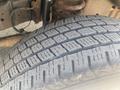 Close-up of a tire from a 2009 Ford Econoline showing detailed tread pattern and texture