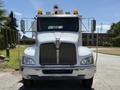 Front view of a 2009 Kenworth T270 truck with a chrome grille and amber beacon lights on top