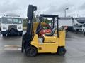 A yellow 2010 Hyster S80XLBCS forklift with a black mast and a seated operator area is positioned in the foreground