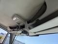 Interior view of a 2009 International 7500 truck showing the overhead storage net and a mounted device on the ceiling