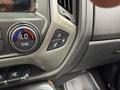 Interior dashboard controls of a 2017 Chevrolet Silverado 1500 featuring buttons for temperature and seat heating adjustments