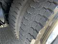 Close-up of a tire tread on a 2012 Freightliner M2 112 showing distinct patterns and grooves designed for traction and stability