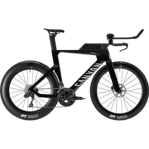 A 2026 Canyon Speedmax CF 7 Di2 carbon triathlon road bike featuring a sleek black design aerodynamic frame and integrated handlebars with DT Swiss wheels