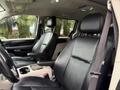 Interior of a 2017 Dodge Grand Caravan showcasing black leather front seats and a steering wheel