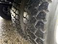 Close-up of a rugged tire on a 2014 International TerraStar showing deep treads and textured surface designed for off-road traction