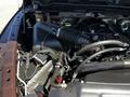 Close-up of a 2015 RAM 5500 engine showcasing the air intake system and various components including hoses and wiring