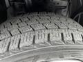 Close-up of a tire tread from a 2020 Nissan NV200 showing deep grooves and patterns designed for traction
