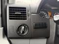 Dashboard controls of a 2017 Mercedes-Benz Sprinter featuring air vents and headlight adjustment knob