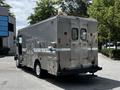 A silver 2008 Morgan Olson Workhorse vehicle with a reinforced body and rear doors featuring ventilation grates and a blue stripe along the side