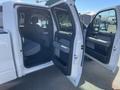 A 2012 Ford F-150 with the front doors open displaying the spacious interior and seating arrangement